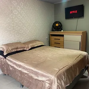 Aconchego Quarto em Acomodações Particulares